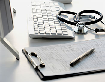 Doctor's desk in evening with no person.